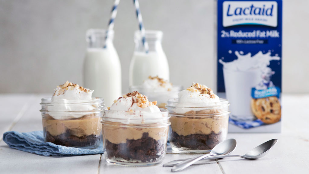 Peanut butter pudding cups with whipped cream and cookie crumbs 