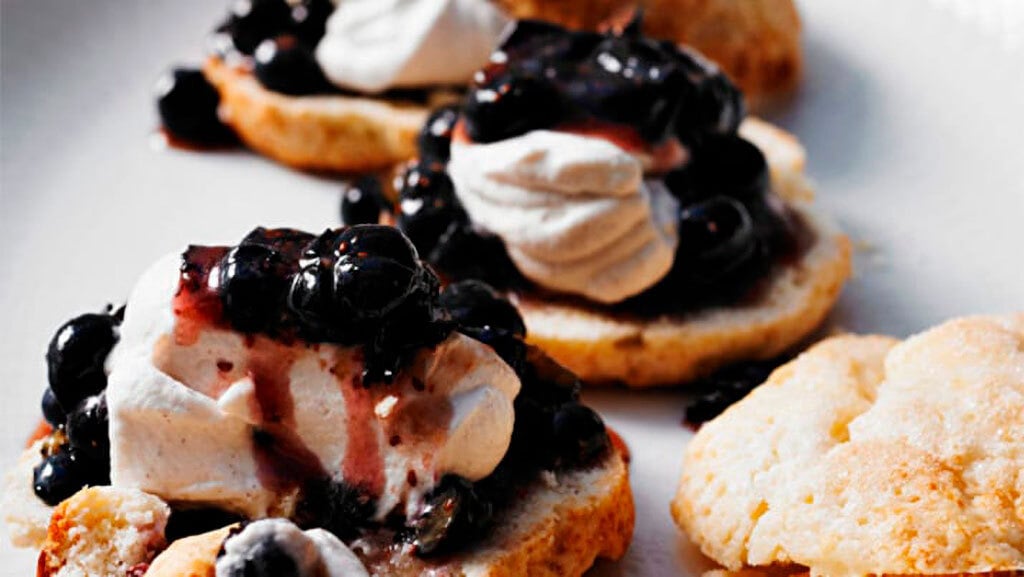 Open-face shortcake with cream and berries