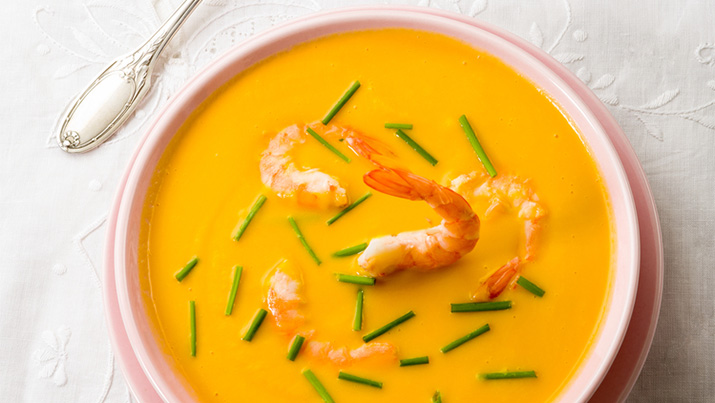 Bowl of spicy pumpkin and shrimp soup 