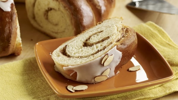 Almond cinnamon bread twirl on tan plate