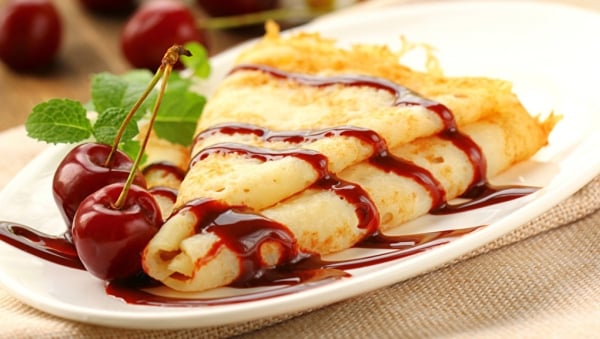 Sweet cherry-cheese crepes with cherry sauce
