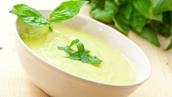 Creamy celery soup topped with basil