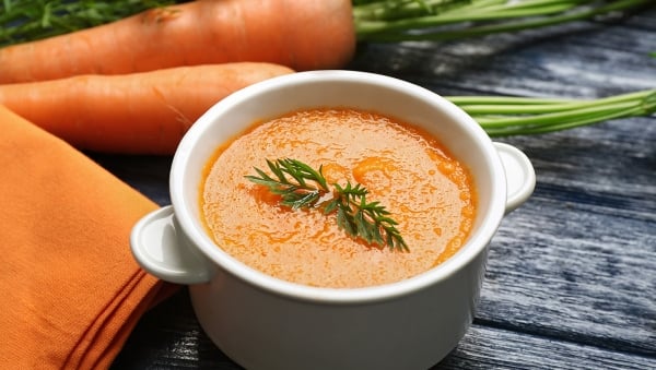 Cup of delicious cream of carrot soup 