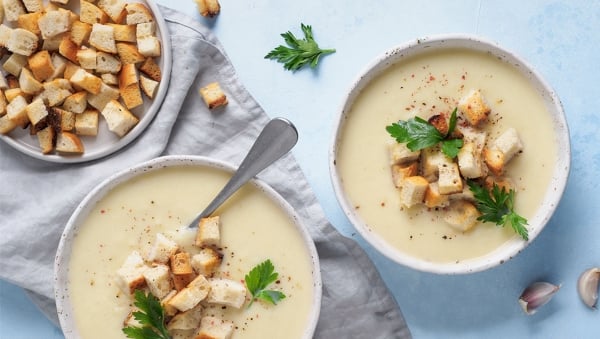Bowl of root veggie soup with curry croutons