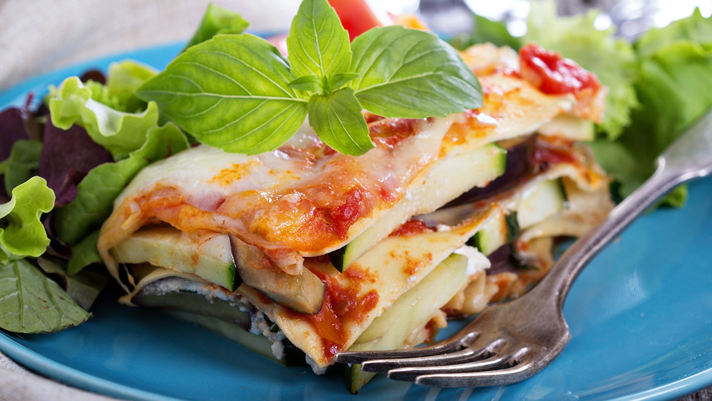 Baked vegetable lasagna with mushroom, zucchini, & side salad 